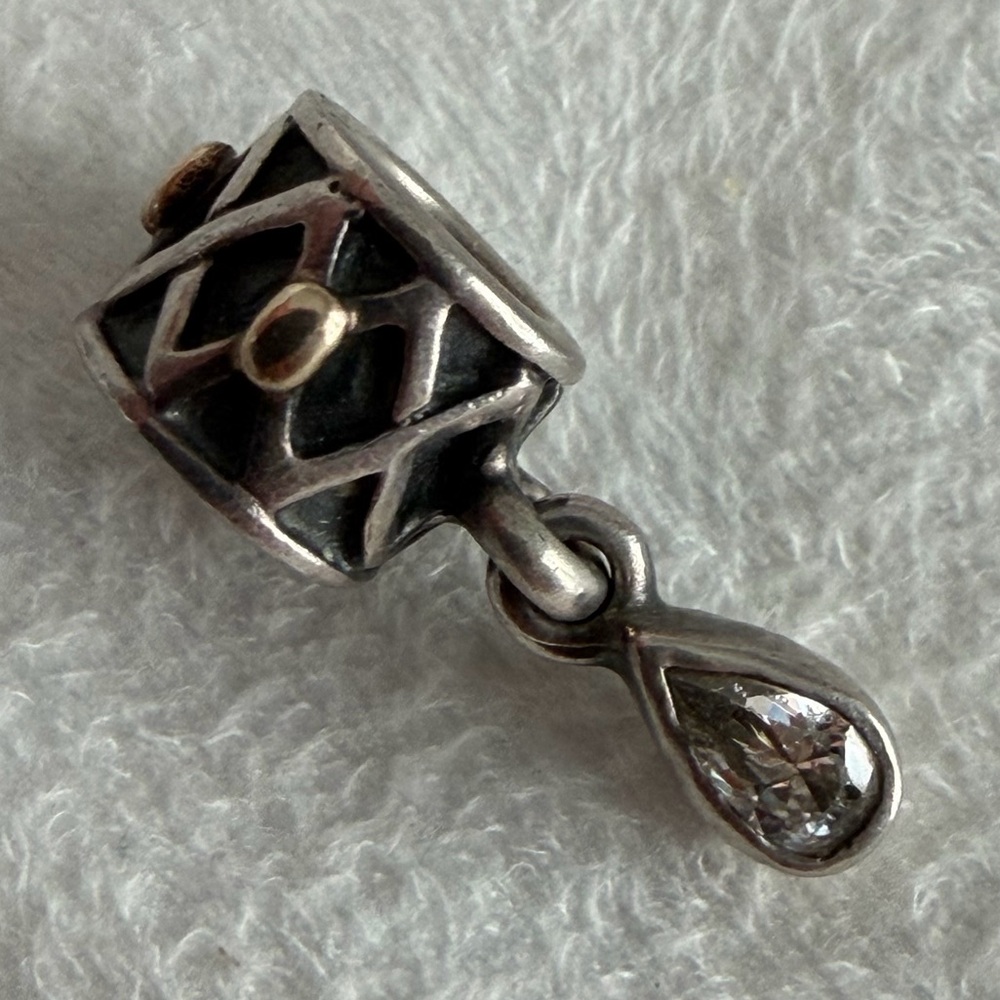 Retired Pandora One World Health charm in sterling silver with 14k yellow gold.